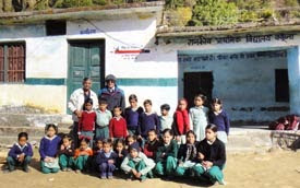 PRIP Kalyan Banerjee (Top right) and PRID Yash Pal Das along with the children in one of the older schools.