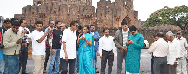 Deputy Commissioner Dr P C Jaffer and visitors at the Bidar Fort read about the monument on Wikipedia.