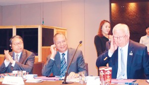 From left: PRID Sang Koo Yun, RI President K R Ravindran and TRF Trustee Ian Riseley listen to translation of the seminar proceedings.