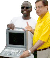 Rtn Dr Raju Sahetya with ultrasound machine.