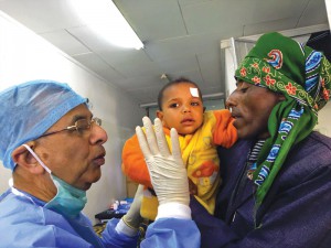 PRIP Raja Saboo talks to the parent of a two-year old child after he undergoes an operation under general anaesthesia.