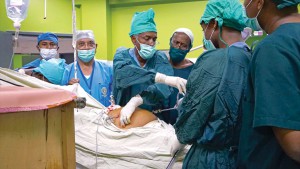 Dr RS Parmar and other Indian surgeons train Ethiopian doctor Abeye Gurnessa in laparoscopic surgery.
