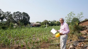 Charter member of the club Sunil Vakil displays the green fields.
