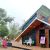 A Rotarian builds a house from plastic waste