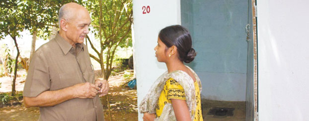 PRIP Kalyan Banerjee interacting with a resident at Amarampedu.