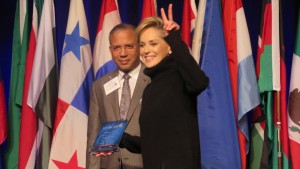Actress and humanitarian Sharon Stone gives the peace sign after speaking at the Rotary World Peace Conference on 15 January in Ontario, California, USA.