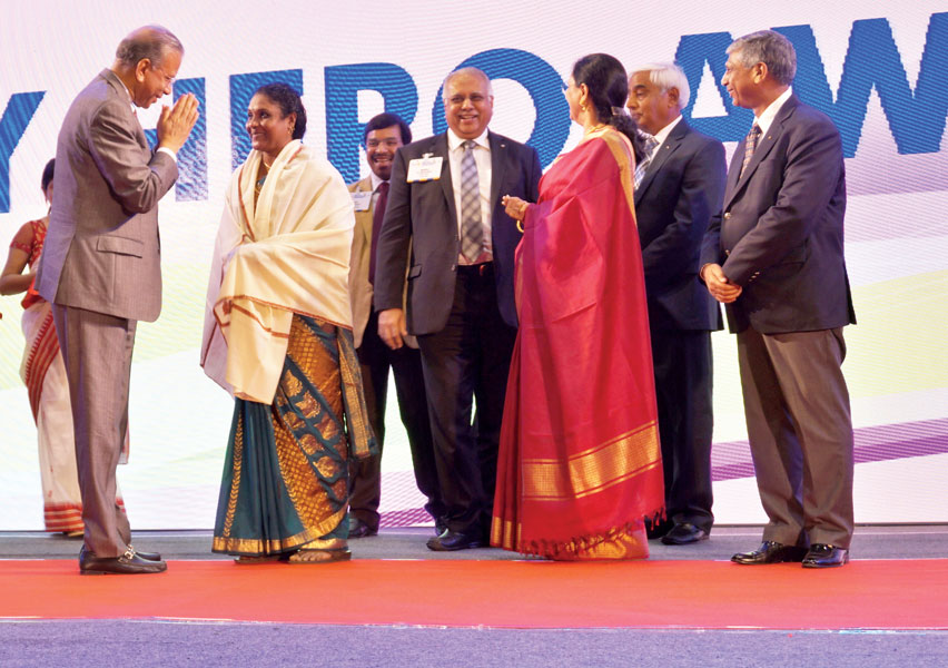 From left: RI President K R Ravindran, PDG Anil Agarwal, RID Manoj Desai and Sharmishtha Desai, PDG Ramesh Chander and PRID Y P Das greet a Literacy Hero awardee, Larzy Verghese. 