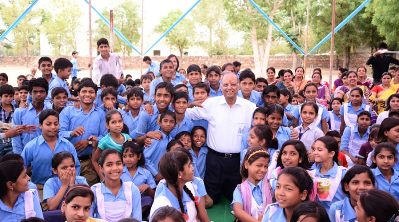 Rtn Suresh Poddar among school children, what he loves best.