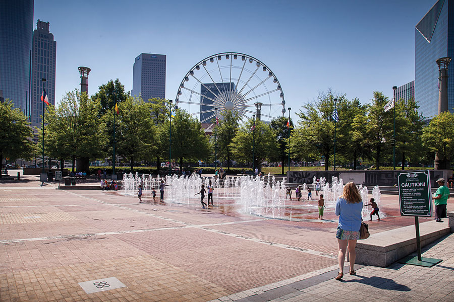 Centennial Olympic Park’s Fountain of Rings splash pad is cool relief for kids and adults alike.