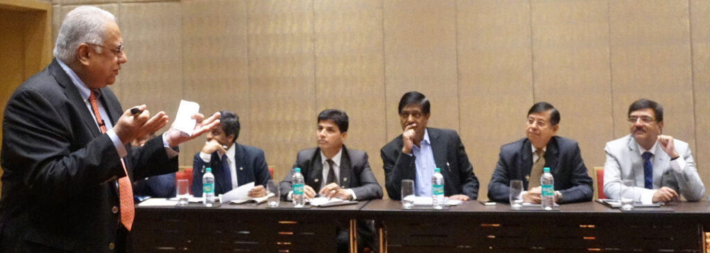 A section of participants in rapt attention as RID Manoj Desai speaks on facilitation.