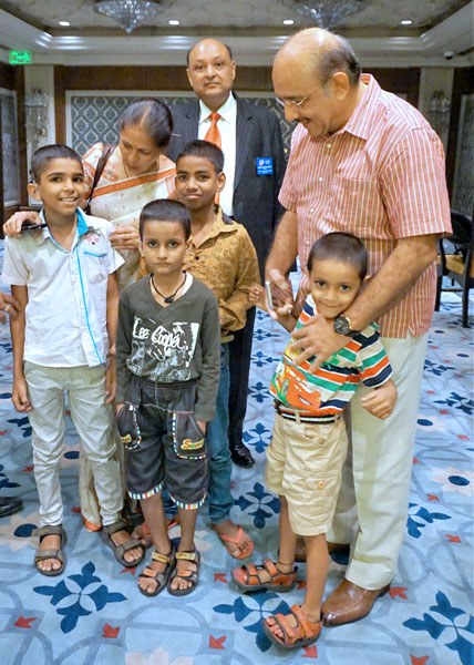 From right: Dr J M Hans and RC Delhi Riverside President G P Agarwal with children fitted with cochlear implants.