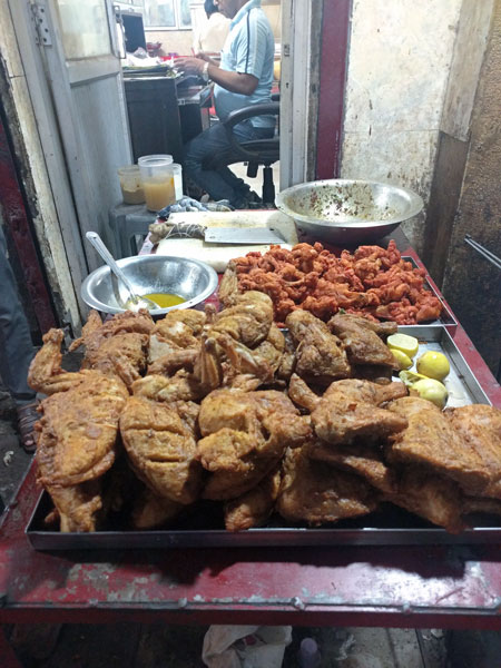 A spread of whole fried chicken.