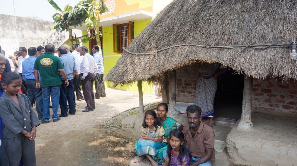 Jyothilingam and his family prepare to shift from his old thatched house to the new one.