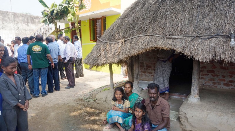 Jyothilingam and his family prepare to shift from his old thatched house to the new one.