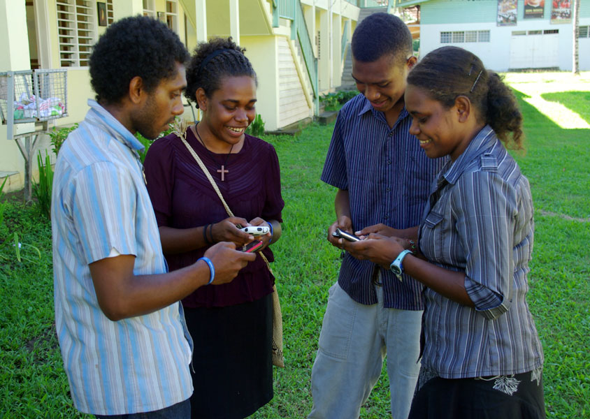donot-bound_apr15_Group_of_young_people_texting_on_mobile_phones