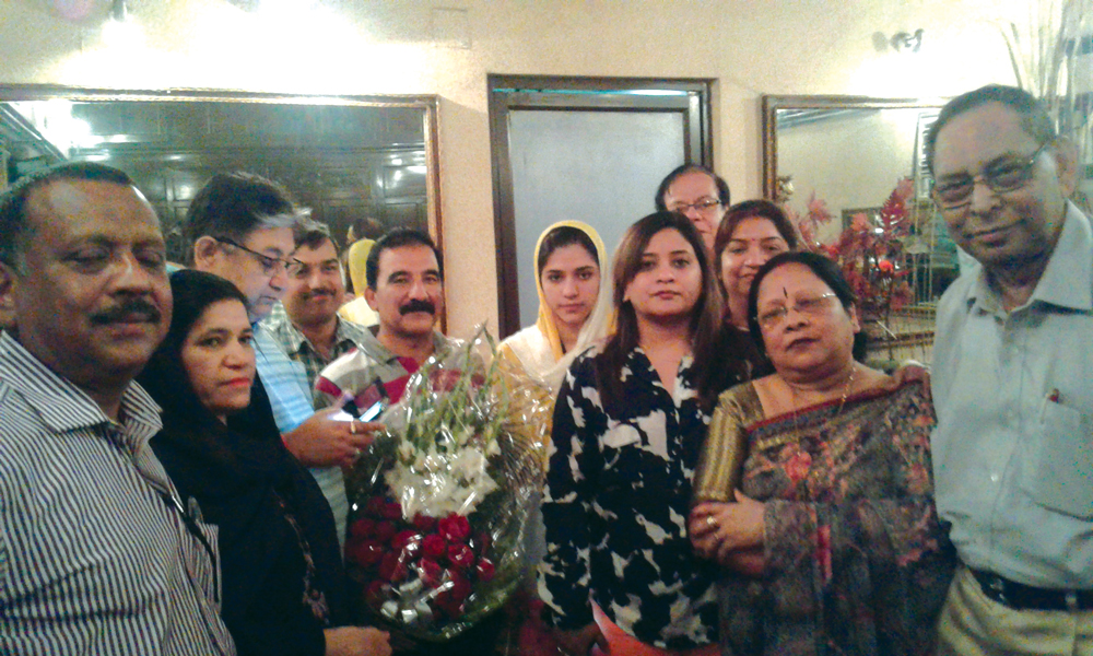 Kolkata Rotarians welcome Gulalai (head covered) and her parents.