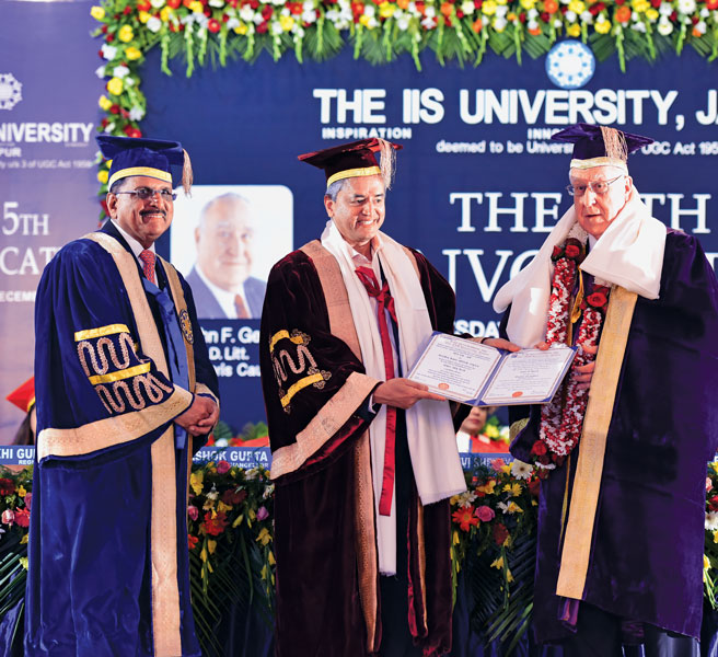 (From R) RI President John Germ receives a doctorate conferred on him by the IIS University, from Cardiac Surgeon Devi Shetty, as University Vice Chancellor and PDG Ashok Gupta looks on. 