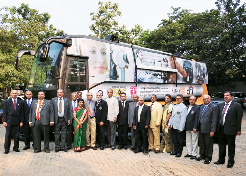 PP of RC Bombay Airport Kevin Colaco, IPRIP K R Ravindran, Deputy High Commissioner in Sri Lanka Arindam Bagchi and D 3220 Governor Senaka Amerasinghe, along with other Rotarians, at the launch of the healthcare bus. 
