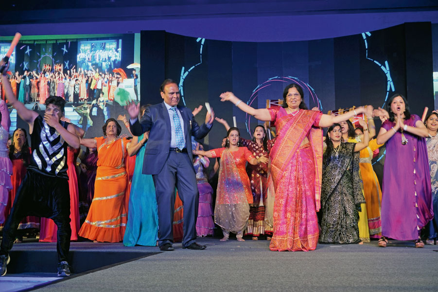 DG Gopal Mandhania joins First Lady of the District Meera and other spouses for a Bollywood dance session.