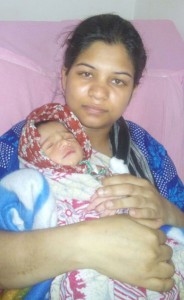 Tabassum with her newborn.
