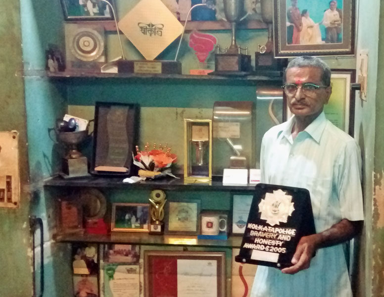 Bipin Ganatra at his home with his numerous awards he had received in honour of his services. 