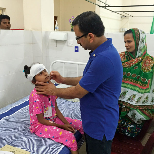 Dr Vikrant Mathur treating a child at the ENT camp.