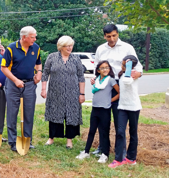 RIPE Ian Riseley and Juliet interacting with children at the Mint Museum of Arts, USA, after planting a tree on its grounds. Many of his predecessors including Paul Harris have planted trees at this campus. 