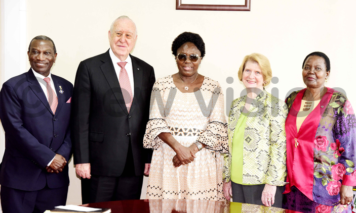 Rotary International president John Germ (2nd L) and wife Judy Germ (2nd R), incoming president Sam Owori (L) and his wife (R) pose for a picture with Speaker of Ugandan Parliament Rebecca Kadaga. 
