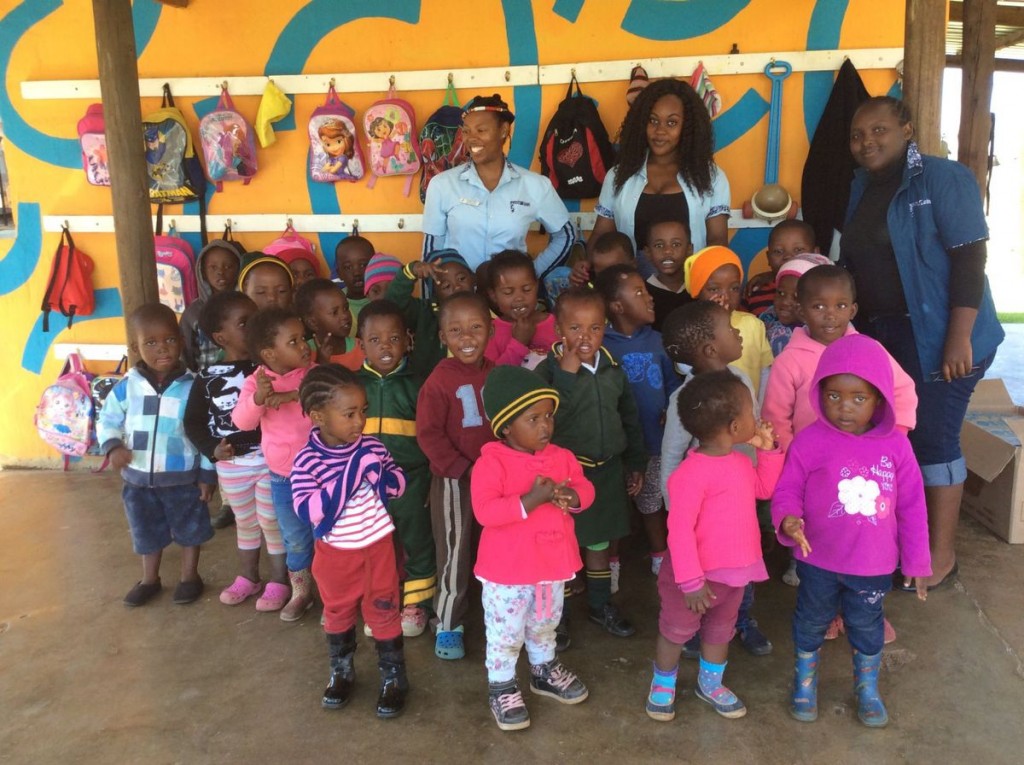 Zandile Khoza, with the headdress,  and children who can now attend a creche which provides childcare and education because of a donation from the East Cooper Rotary Club.