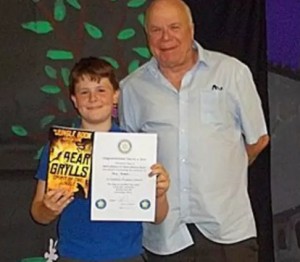 Max Green of Ab Kettleby Primary School with his award from Rotarian Tony Pick.