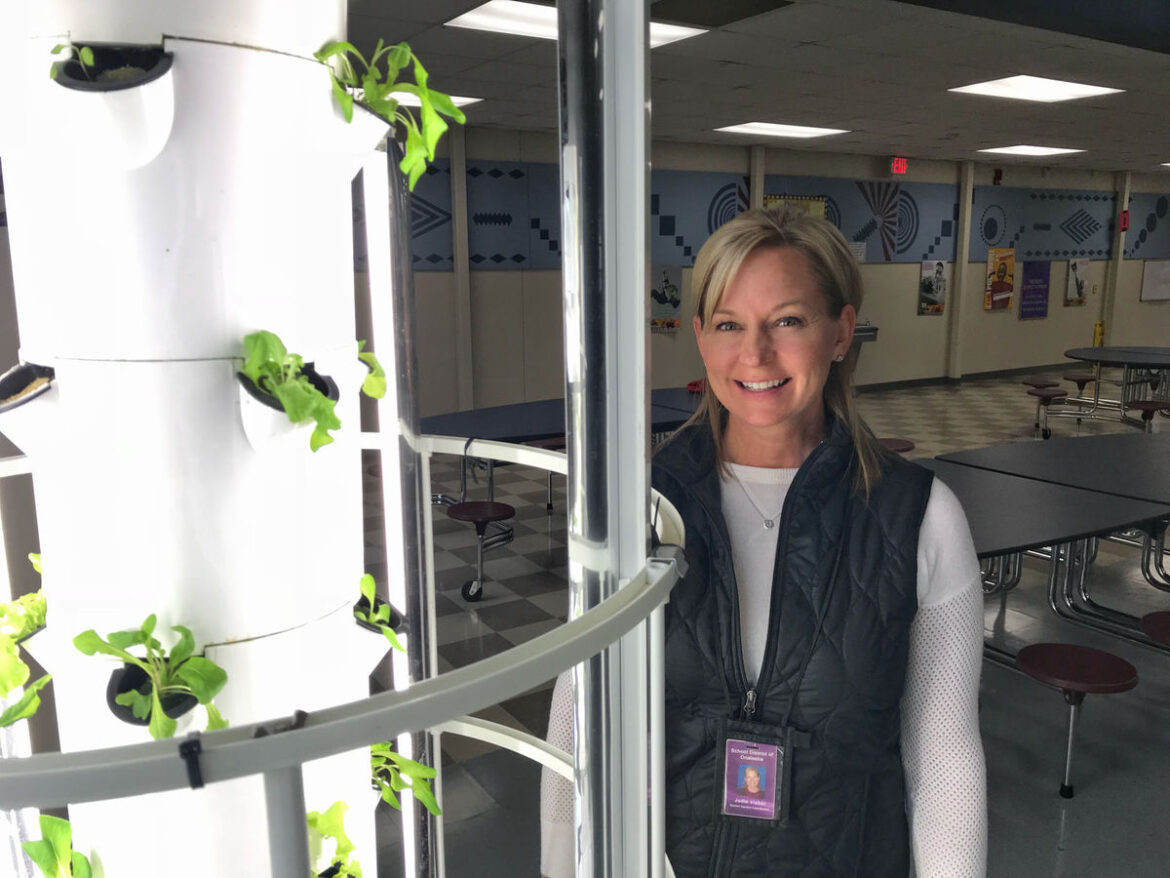 A club donates to help grow tower of food