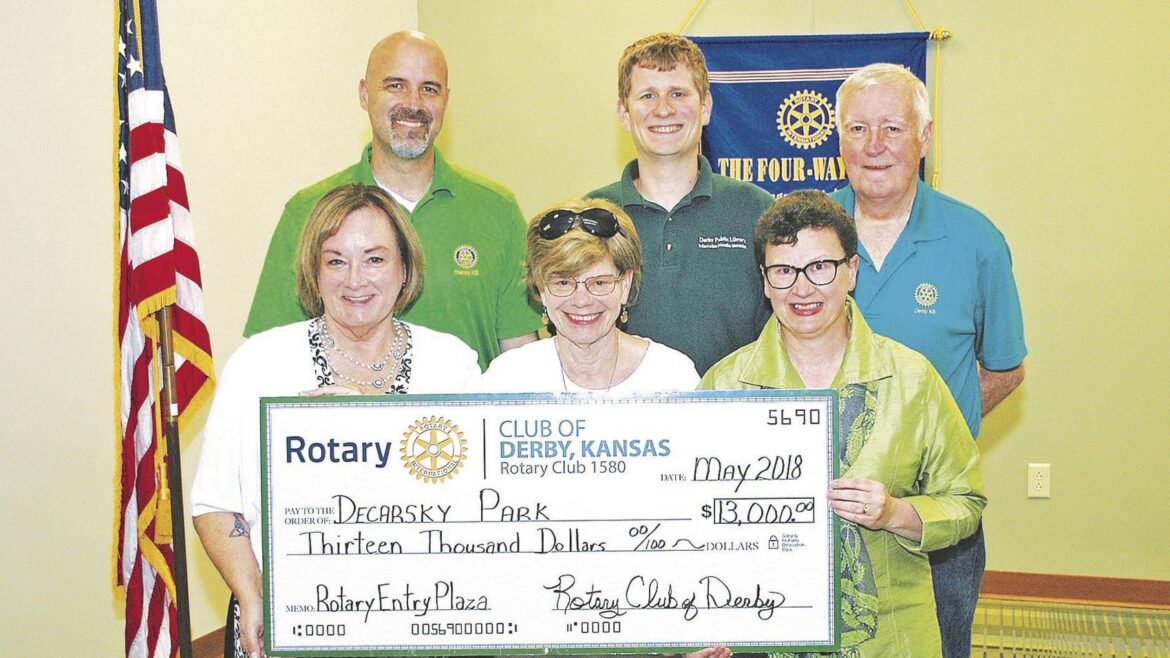 A decked up park entrance with big trees