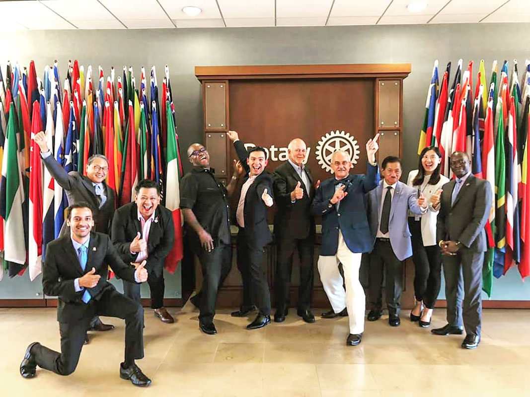 PRIP Barry Rassin (centre) and Elevate Rotaract Task Force Chair David Stovall (fourth from R) - File photo.
