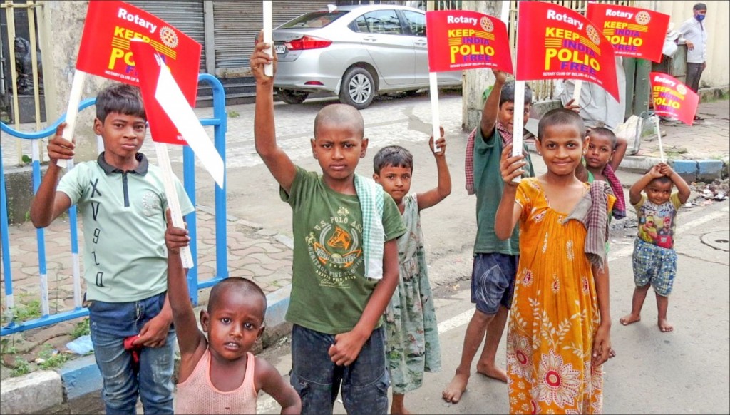 Street children in Belur display flags on a Polio-free India. RC Belur, RID 3291 undertook this activity to spread awareness about the importance of polio immunisation, particularly in vulnerable sections of society. Picture by Rakesh Bhatia.