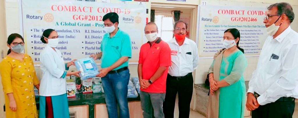 DG Prashant Jani, his wife Hita and AG Mihir Thackar at a PHC in Kachholi to hand over the protective gears.