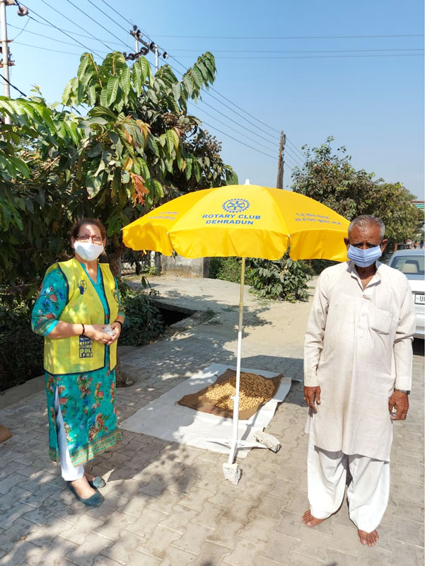 RC Dehradun, RID 3080, donated giant umbrellas with the Rotary Wheel and End Polio Now logo to local vendors.