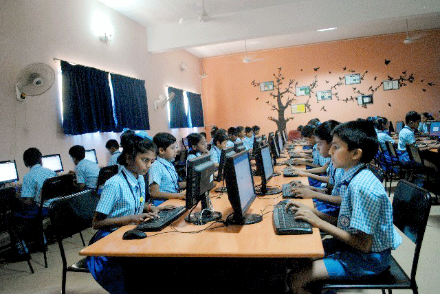Children working with computers at the Ideal Jawa Rotary School (file photo).