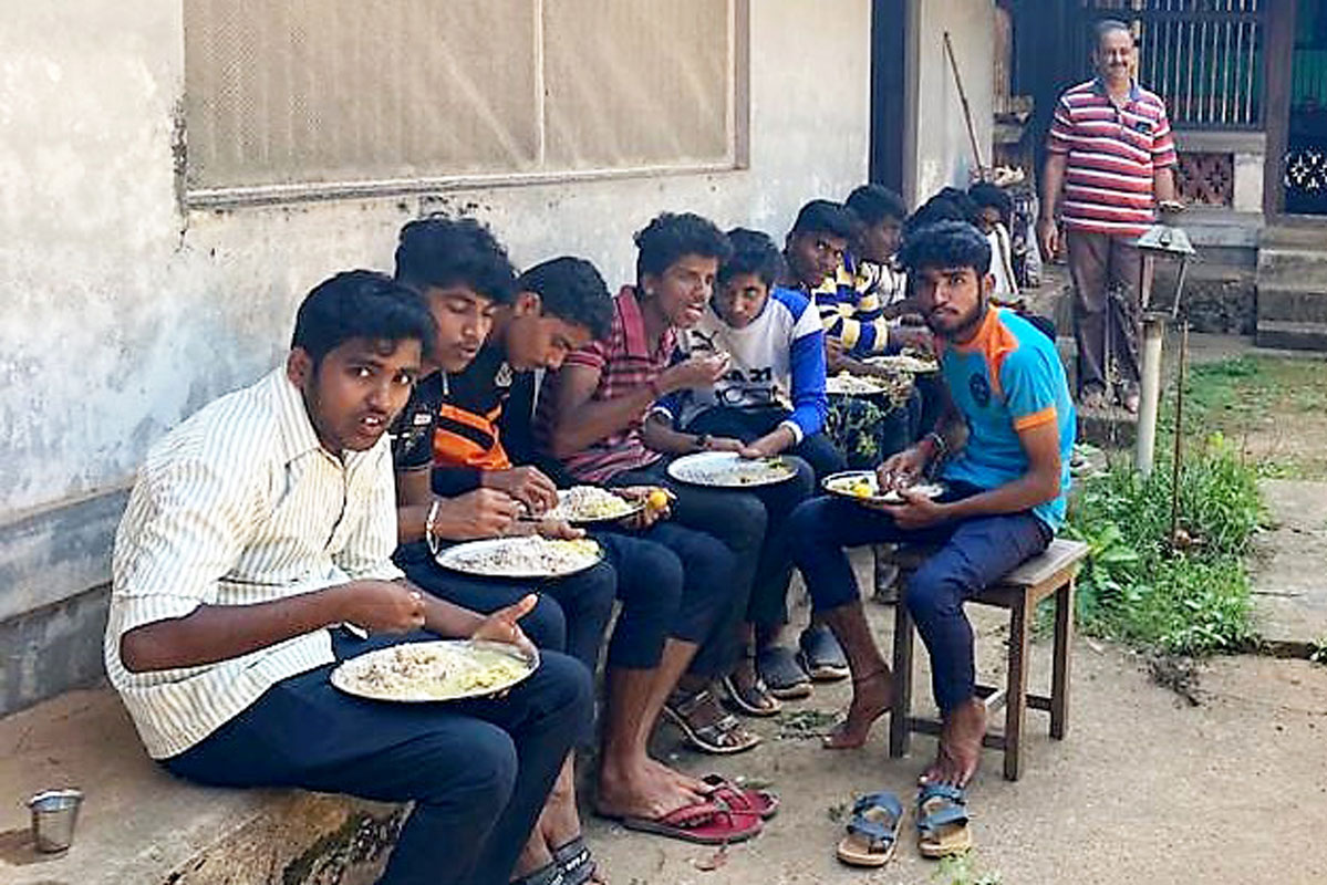 Fresh, home-cooked food being served to Rotaractors helping in construction of check dams.