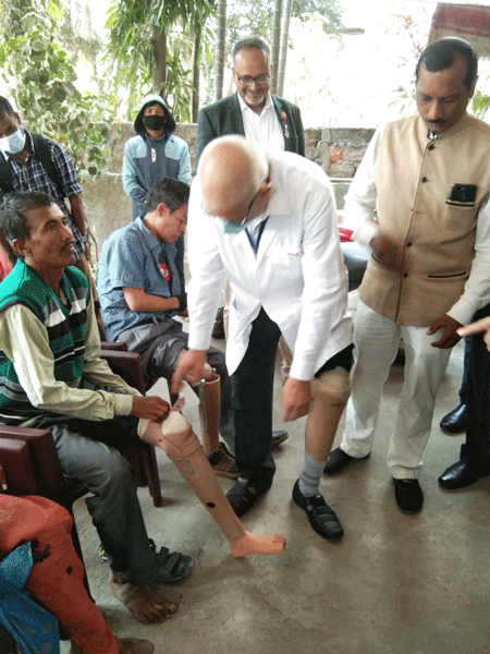 Dr Sushil Surana, limb fitment in charge at the Mahaveer Viklang Sahayata Samiti, checking out on the beneficiaries.