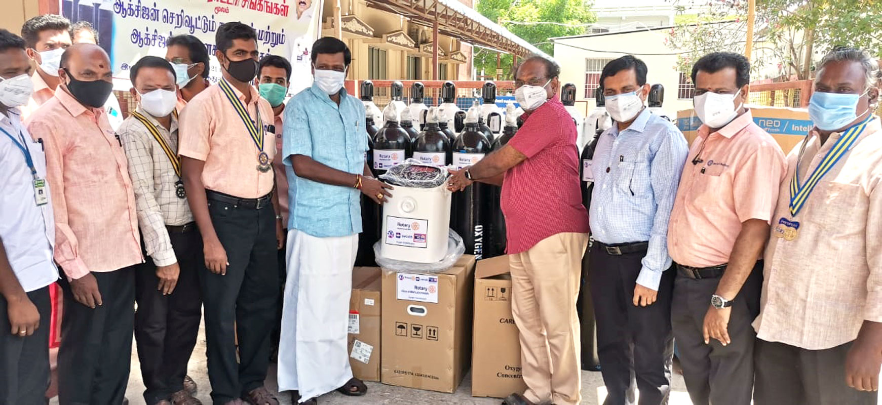 Mayiladuthurai MLA S Rajkumar (centre, left) hands over oxygen concentrators to Dr R Rajasekhar, CMO, government hospital in the presence of DG R Balaji Babu (third from R), RC Mayiladuthurai president K Durai (R) and project coordinator V Raman (fourth from L). 
