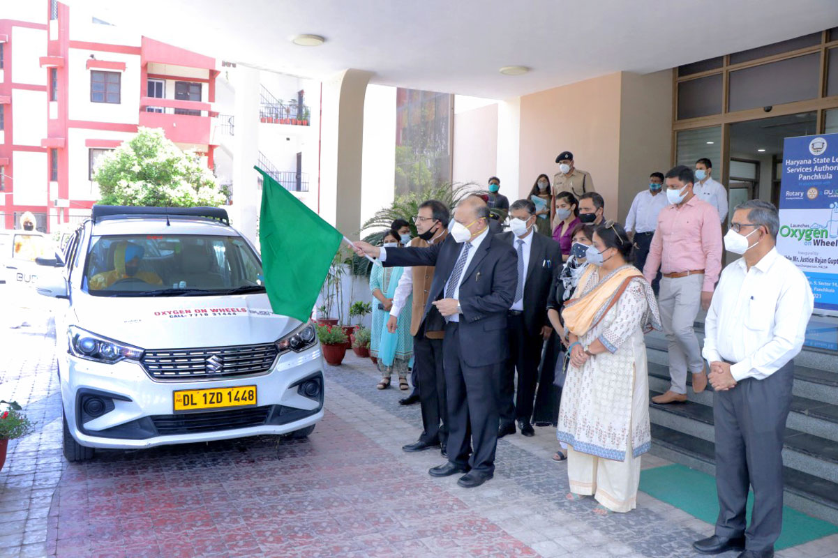 Justice Rajan Gupta from the Punjab and Haryana high court flagging off the Covid cabs in the presence of Rotarians.