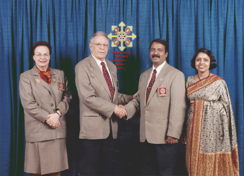 Rashi and RI President Shekhar Mehta (then DGE) greets Carlo Ravizza, the then RIPE, and Rossana at the 1999 International Assembly. 