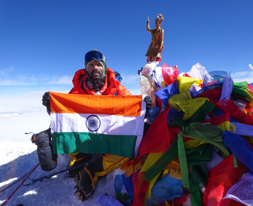 Chawale proudly displays the Indian national flag on reaching the summit of Mt Everest.