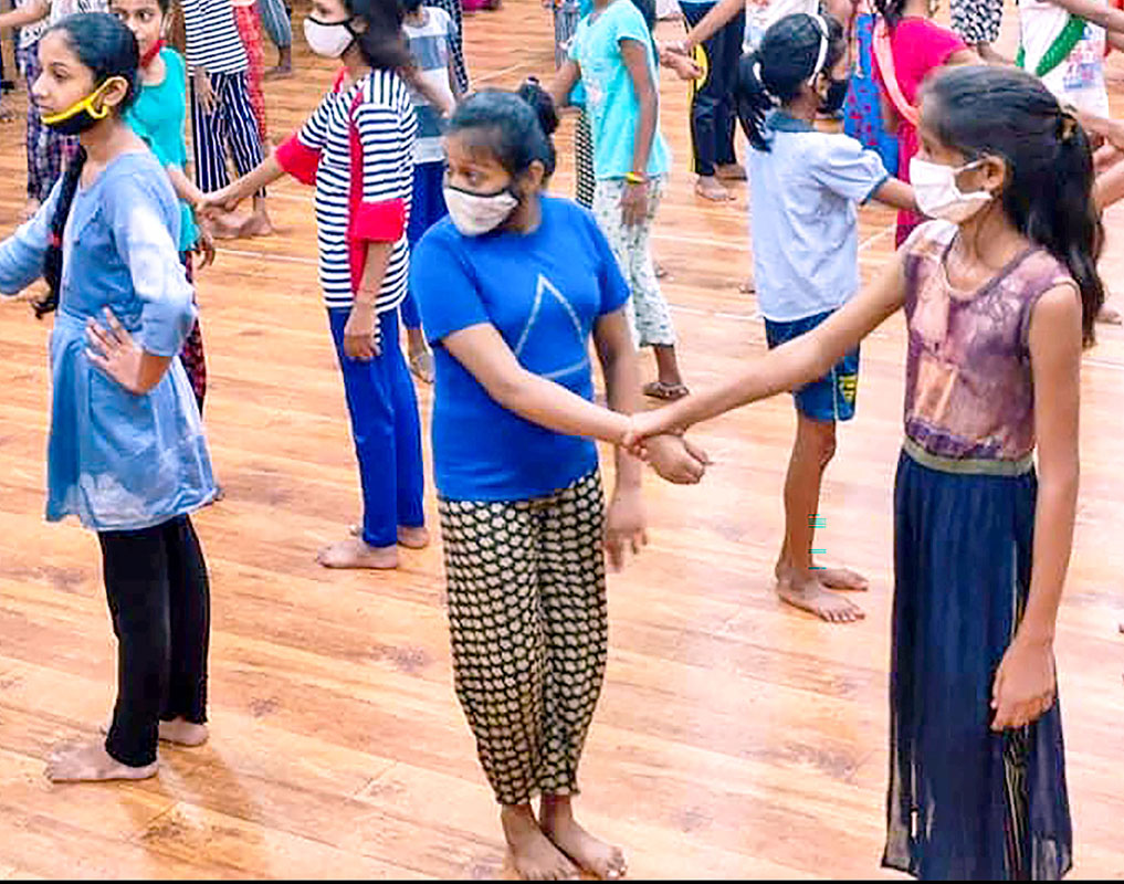 Girls learn self-defence techniques at the workshop.