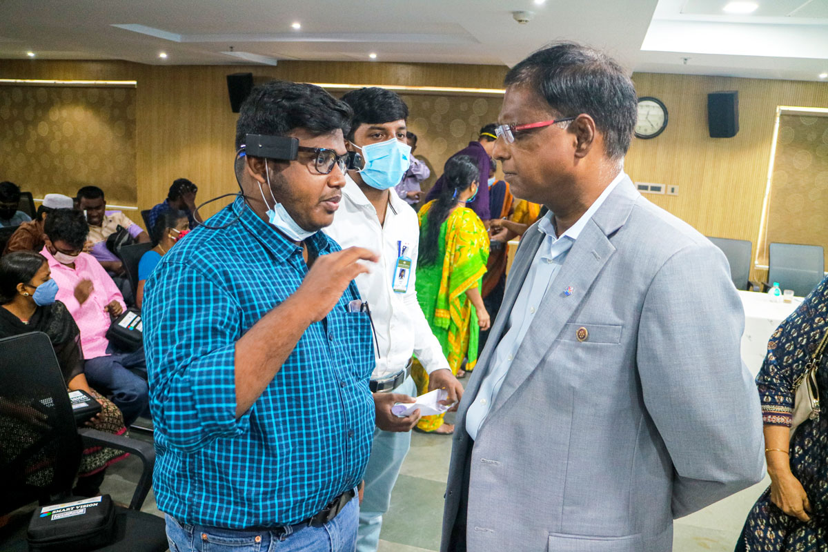 DG J Sridhar interacting with a beneficiary.