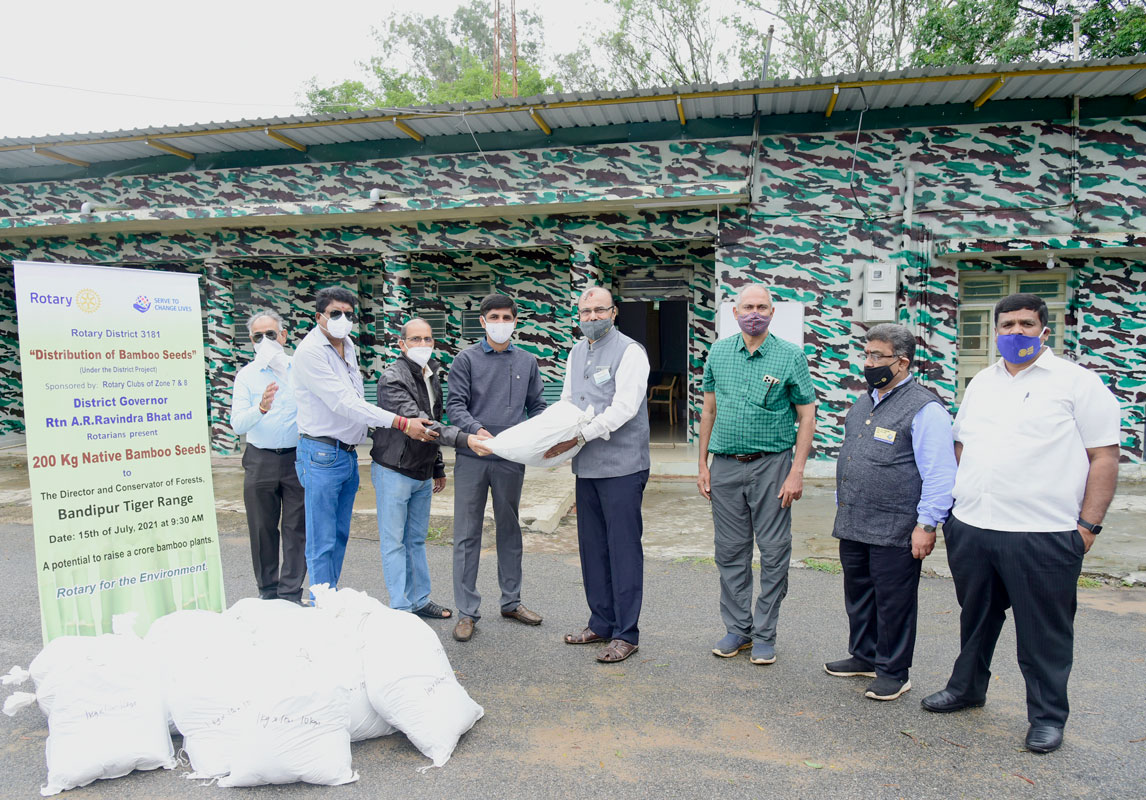 DG A R Ravindra Bhat handing over bamboo seed bags to the forest ranger at the Bandipur Tiger Reserve in the presence of the district chairman for the Supporting Environment committee C R Hanumanth (to the DG’s left), AG S R Swamy and RC Mysore West president Dr B Chandra. 