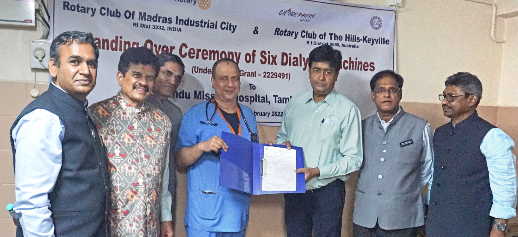 RID Venkatesh gives the warranty agreement for dialysis machines to Hindu Mission Hospital medical director Dr D K Sriram in the presence of (from L) club president Satheesh Kumar, Vinod Saraogi, DRFC Ambalavanan, DG Sridhar and district secretary R Ravi Shankar. 