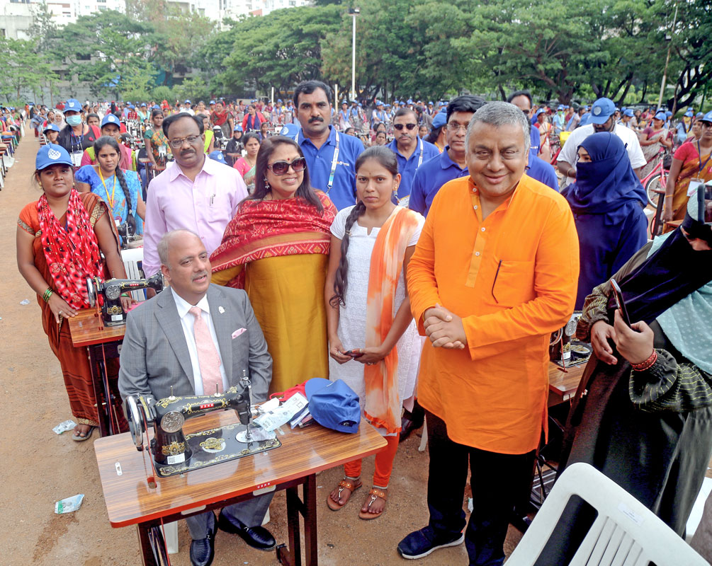 President Mehta and Rashi with Conference Chair Vadlamani and PDG J Abraham at the 500 sewing machines distribution project.