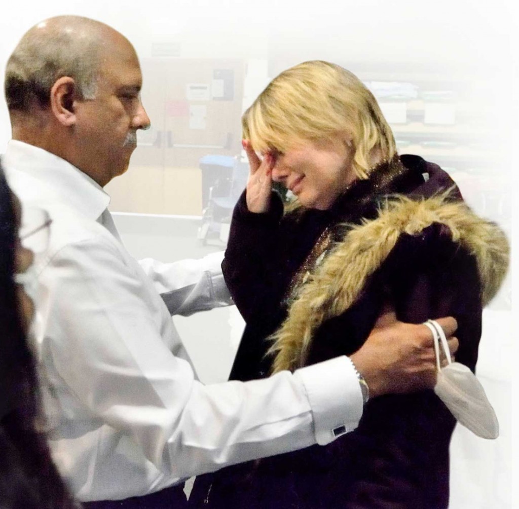 While visiting Poland, Mehta consoles a war-affected Rotarian from Ukraine.