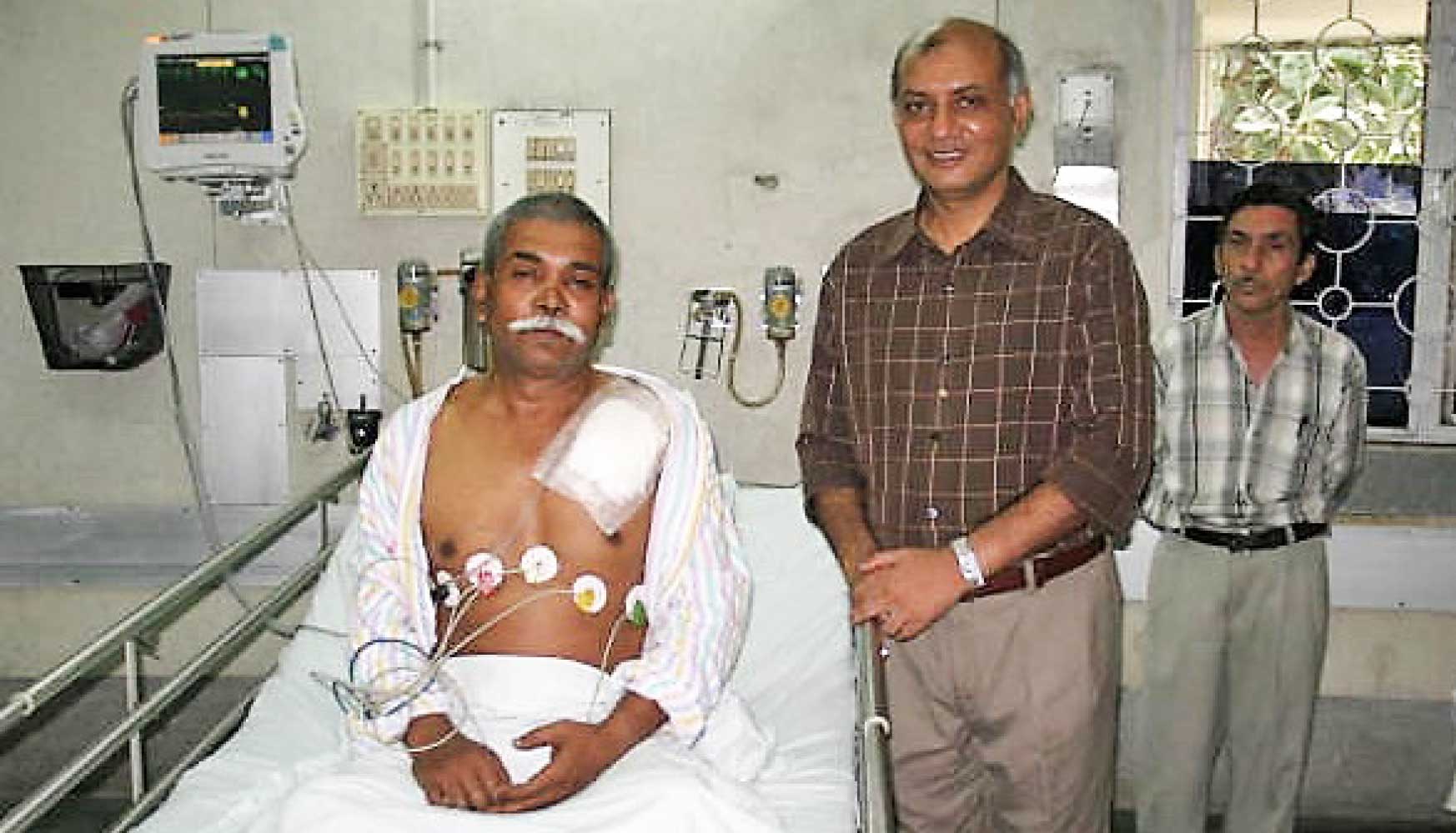 PRID Kamal Sanghvi with a beneficiary.